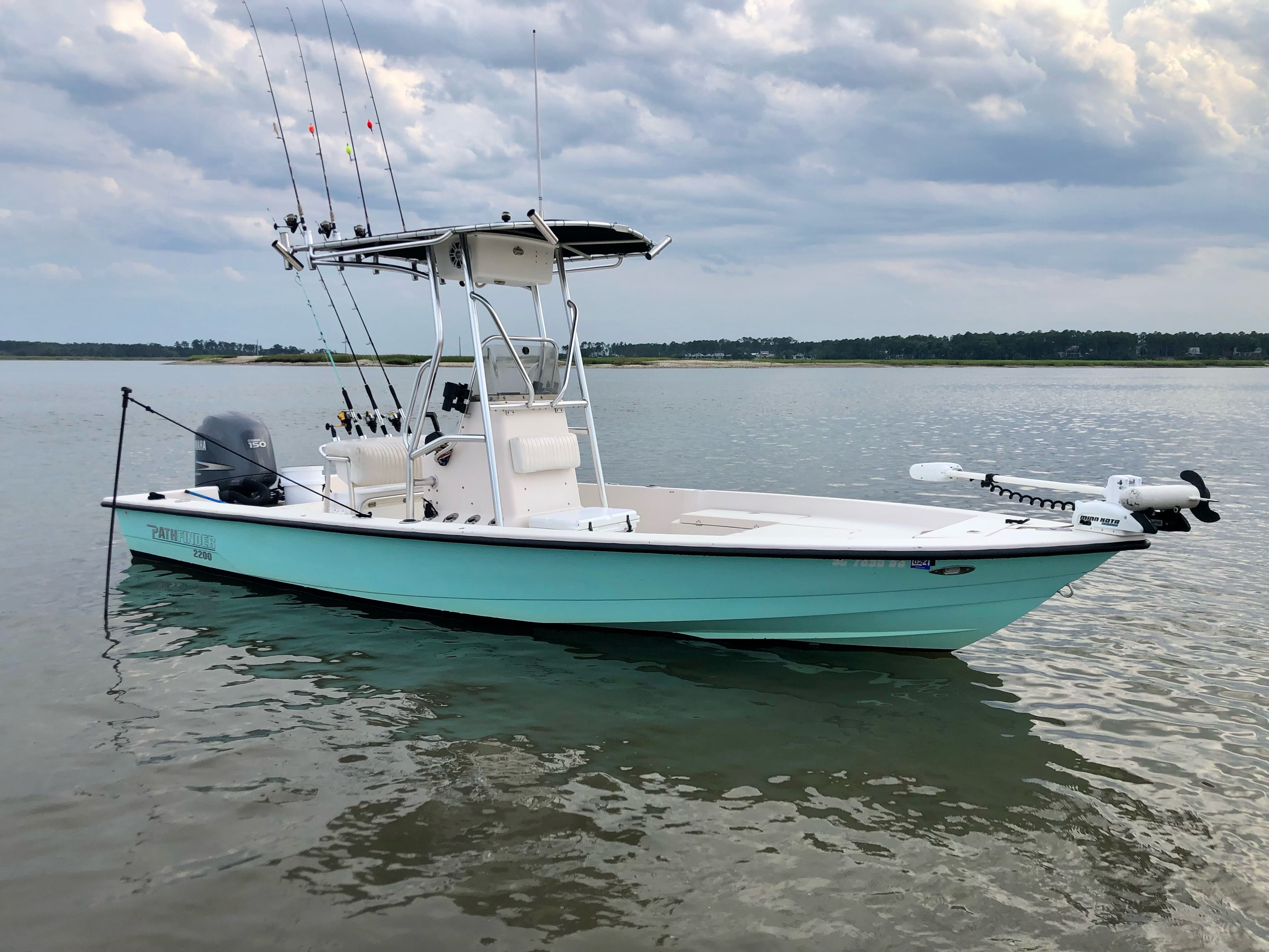 Lowcountry Cowboy’s sea foam green 22-foot Pathfinder fishing boat anchored on Hilton Head waters