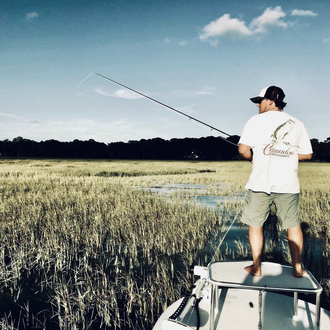 Captain Campbell Goss casting from the bow into the Hilton Head salt marsh